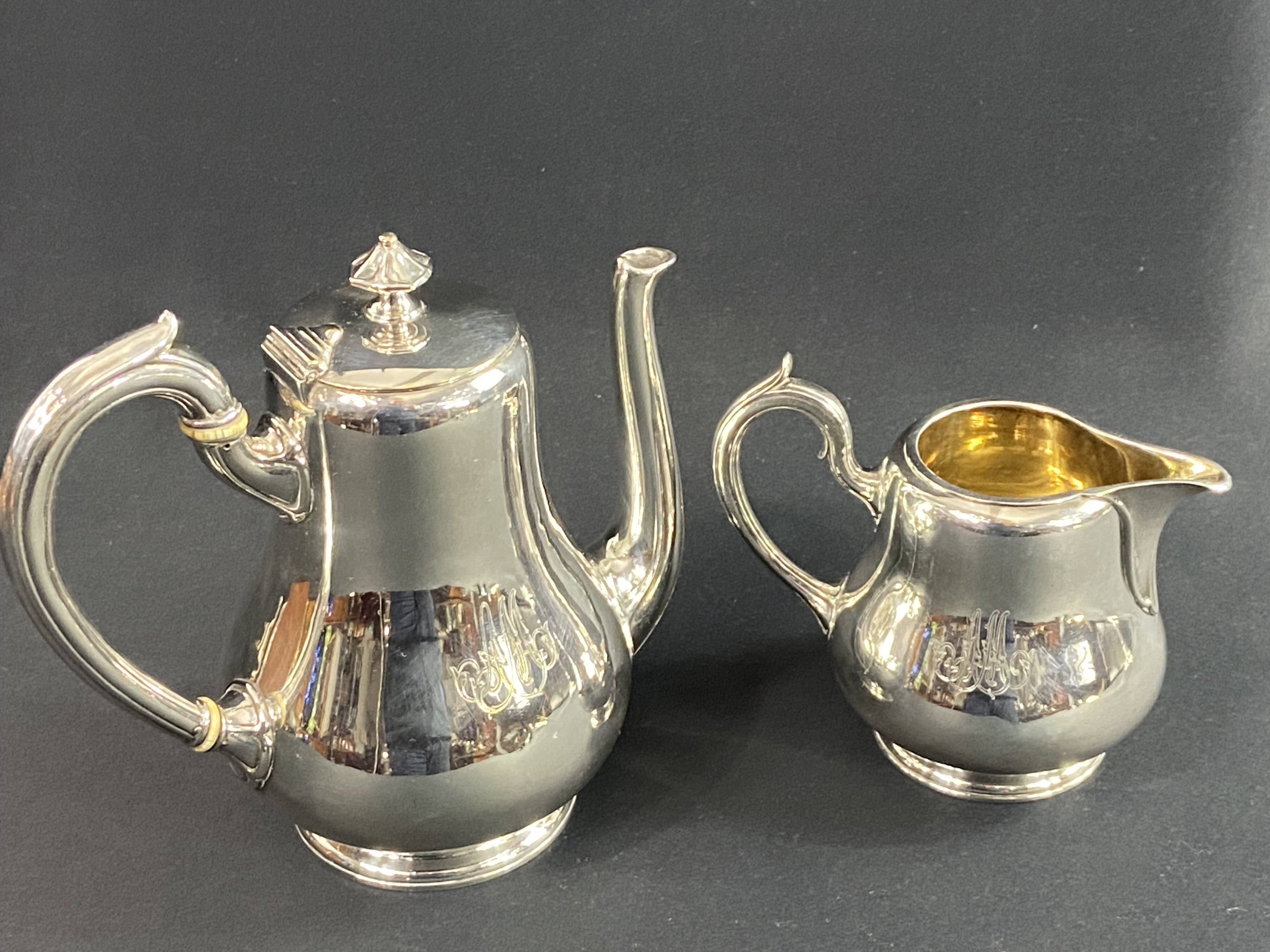 Silver-plated coffee pot and milk jug monogrammed MA, signed CHRISTOFLE.