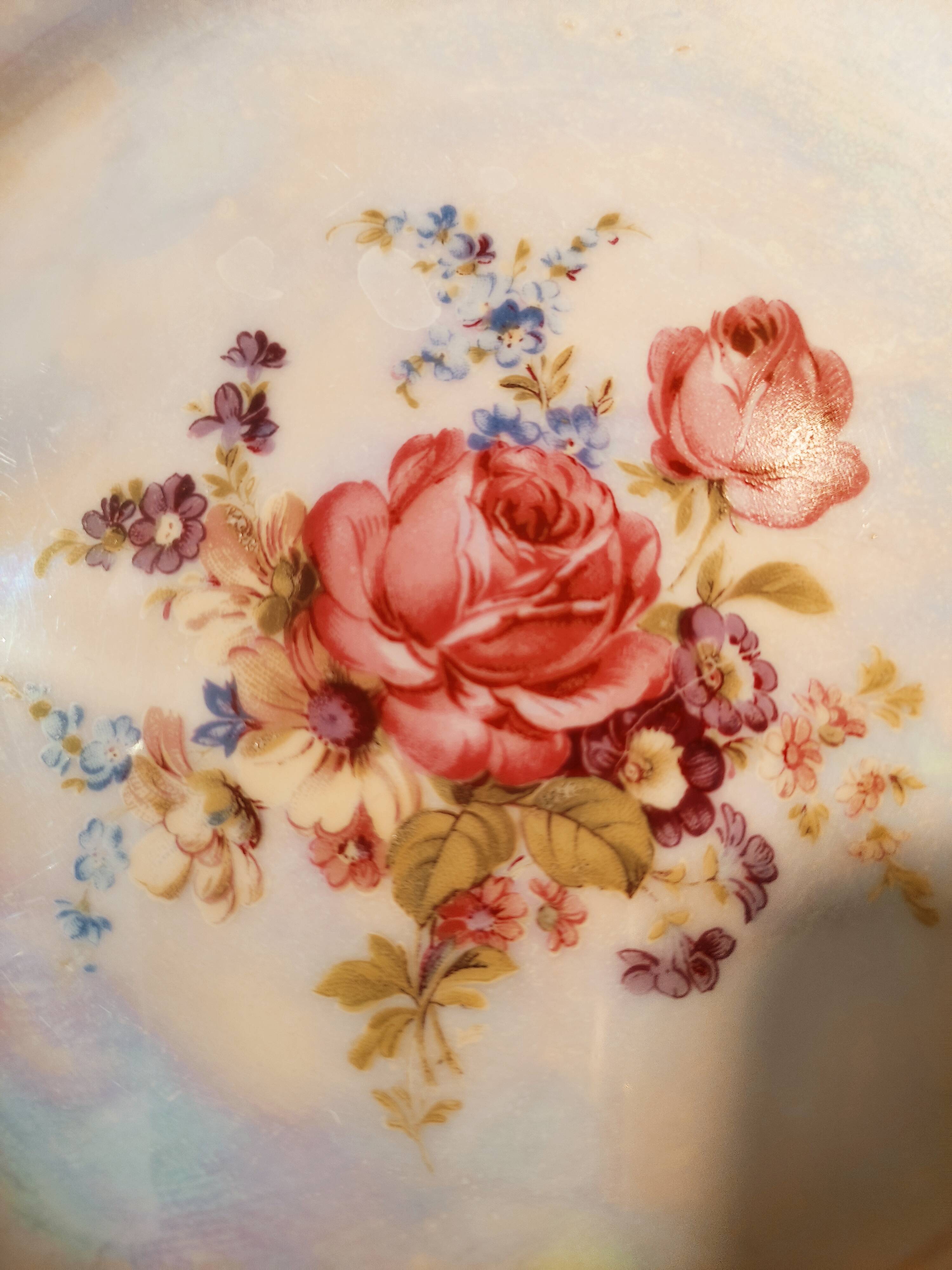6 mismatched dessert plates decorated with roses