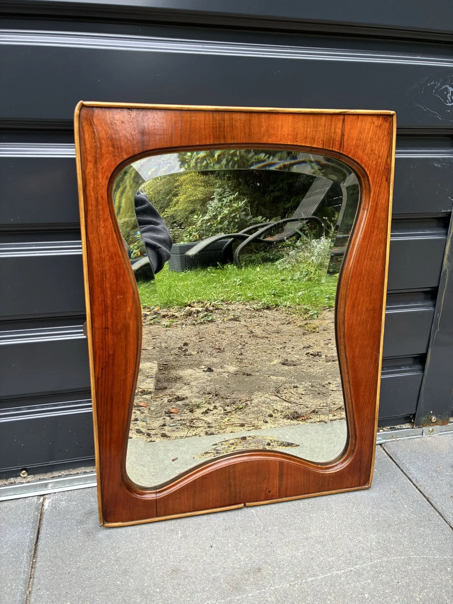 Mid-century organic shaped bevelled mirror in wooden frame, 1940s-50s