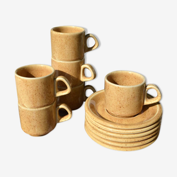 Series of 6 sandstone cups and saucers