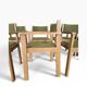 Vintage wooden chair with olive green seat and armrests.
