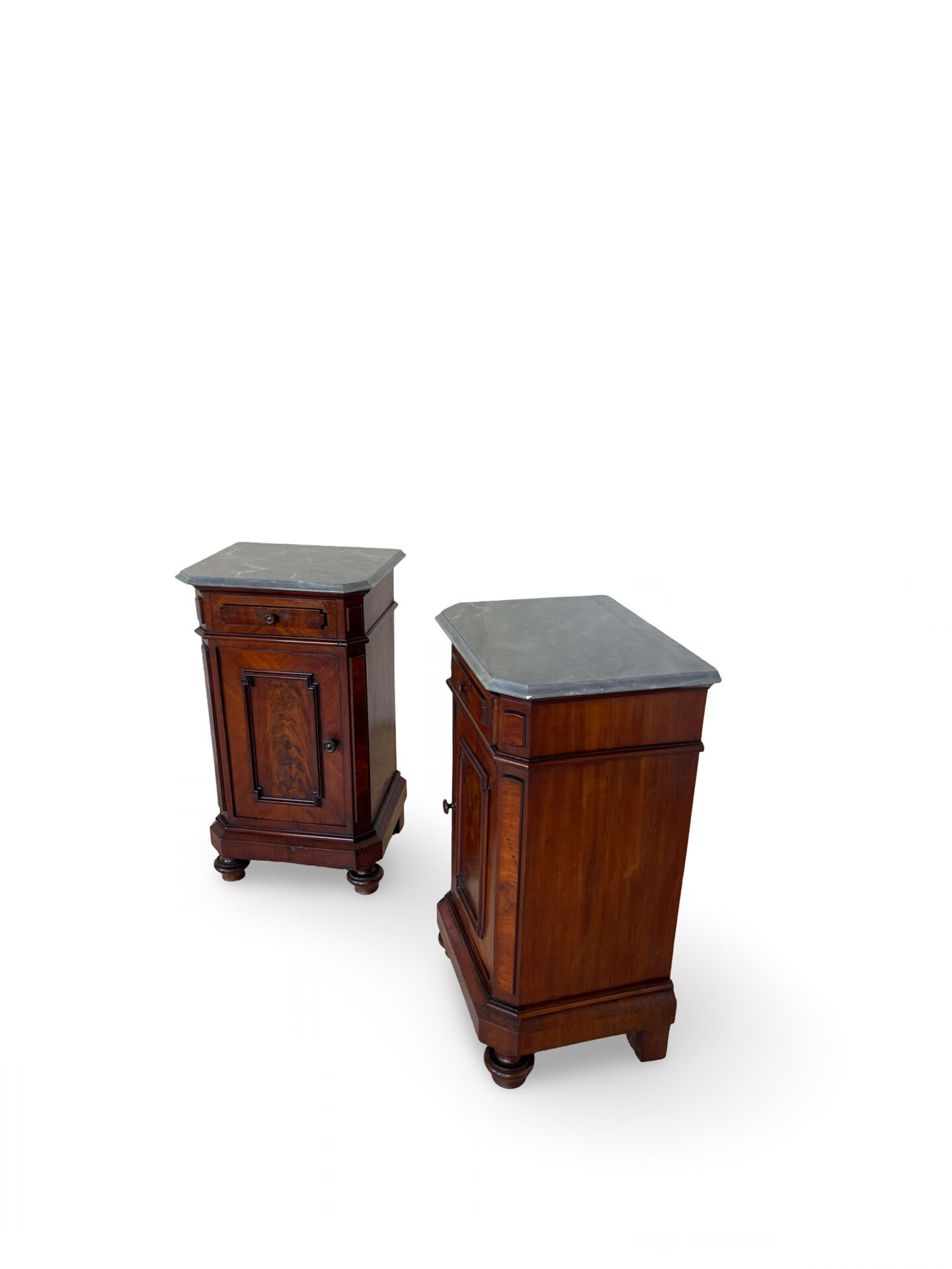 A pair of antique walnut bedside tables from the 1890s.