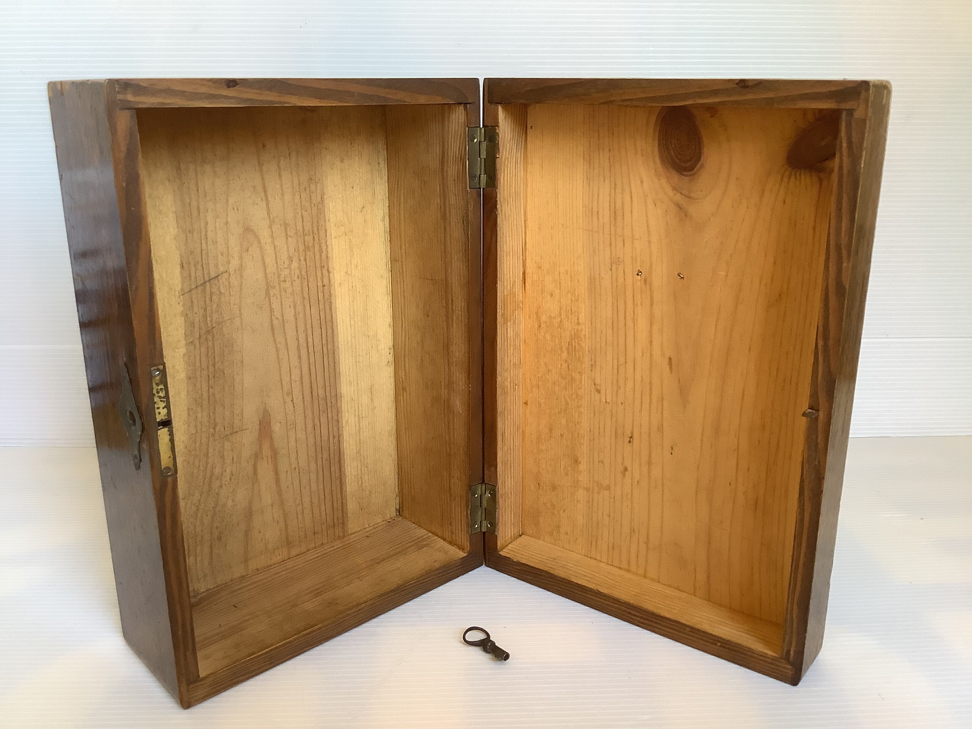 Old wooden box with handle and metal keys