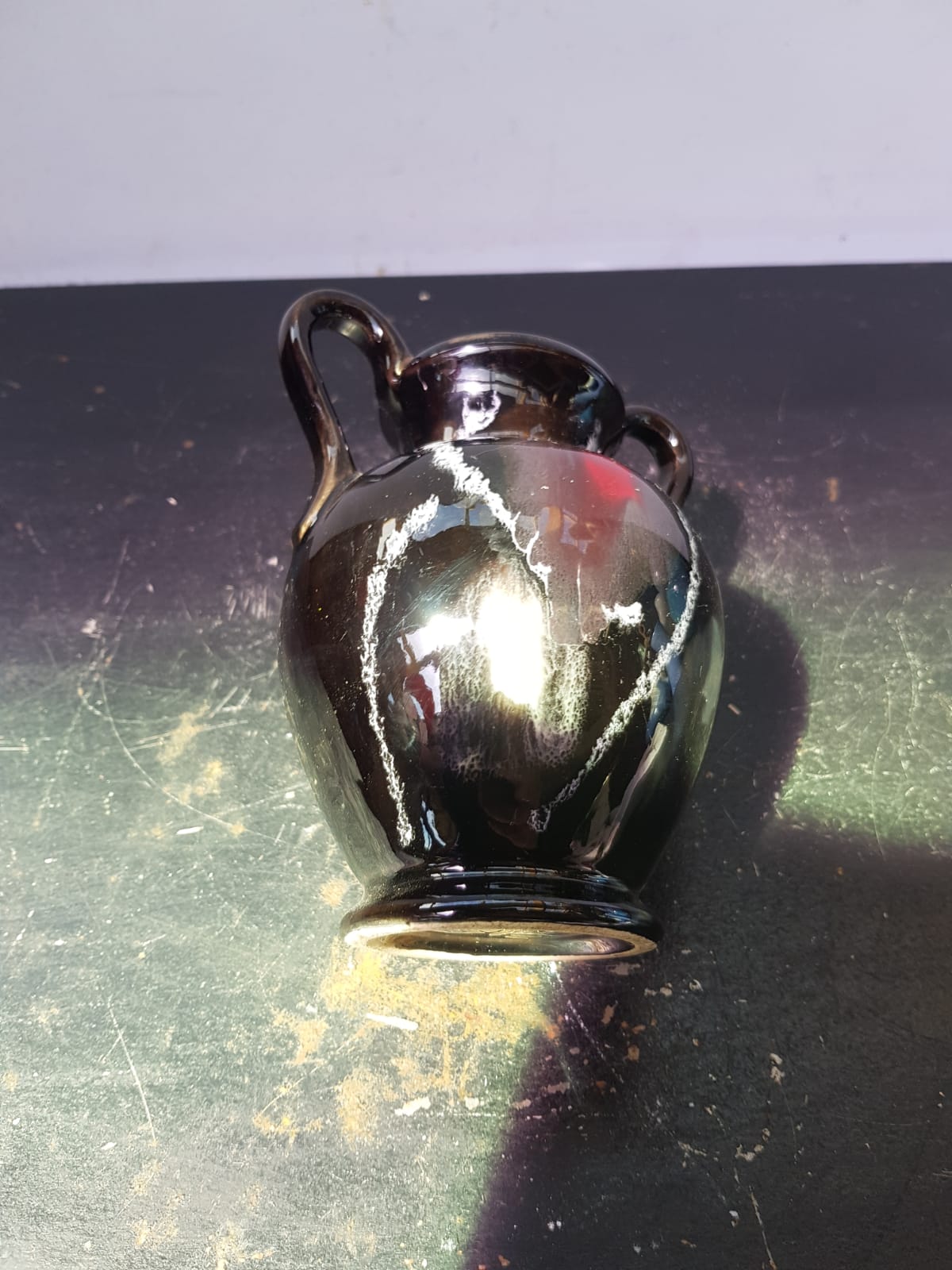 Old vase with coves ceramic black