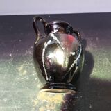 Old vase with coves ceramic black