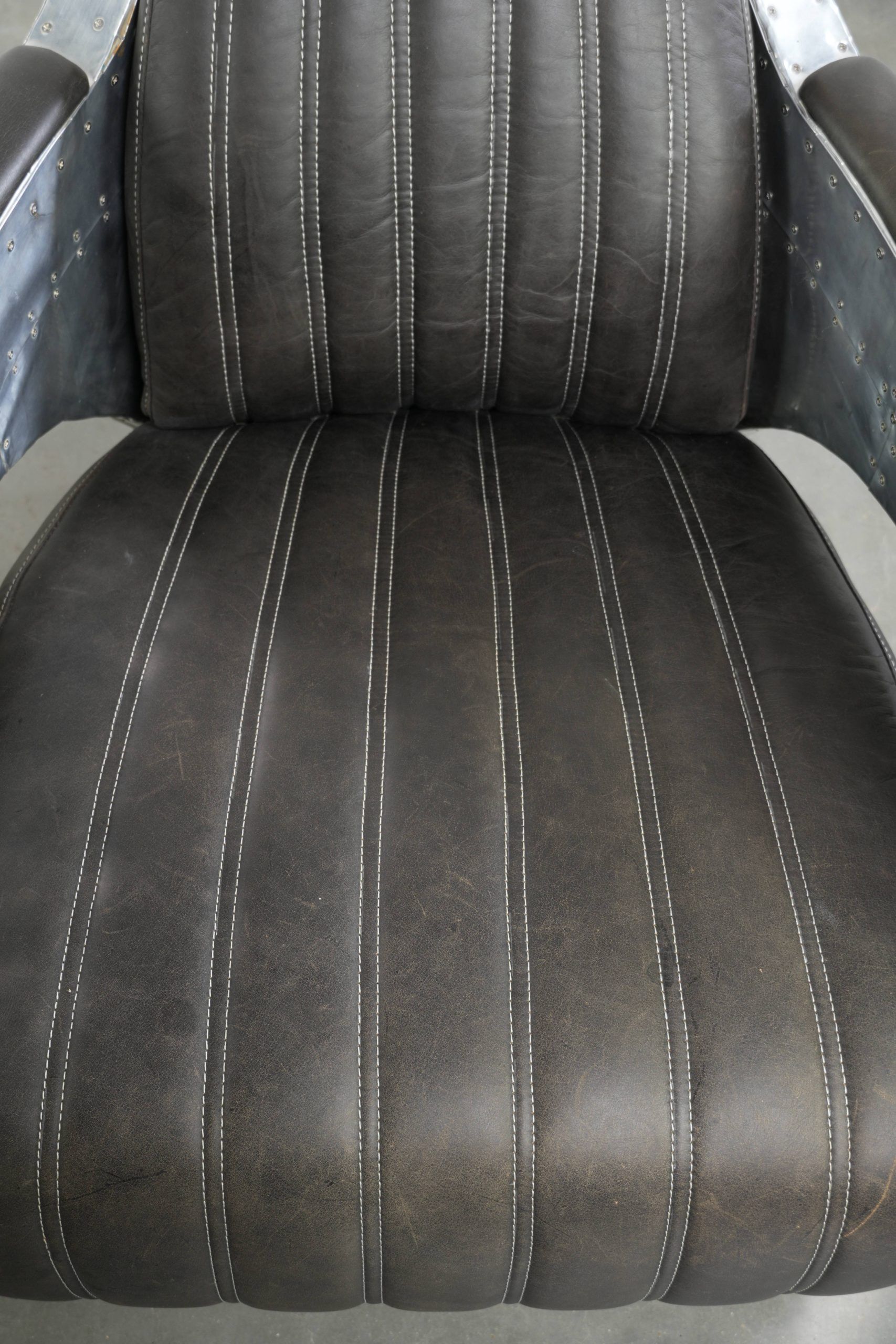 Set of 2 sturdy industrial black cowhide Aviator design armchairs with aluminium and rivets