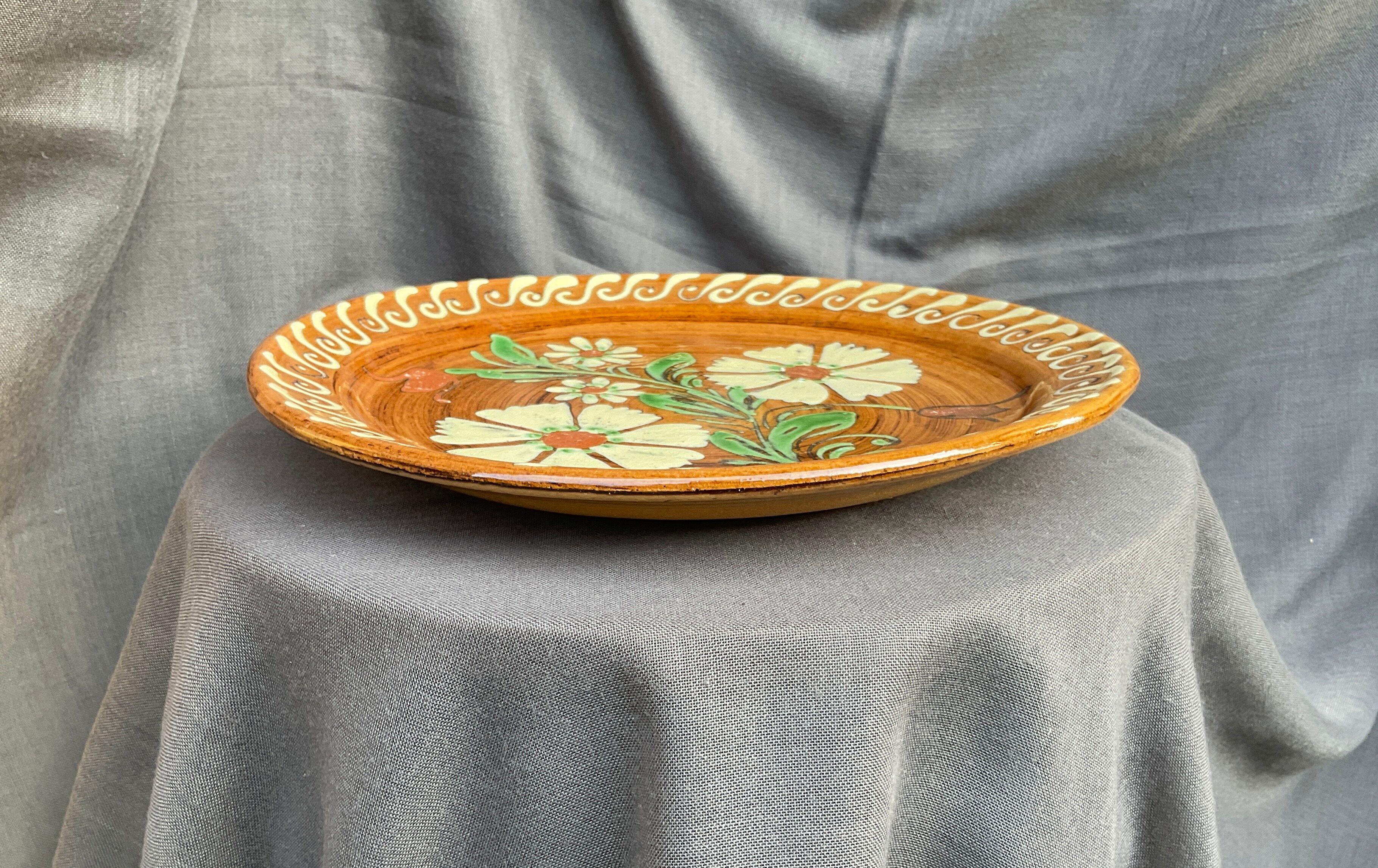 Terracotta plate with floral decoration