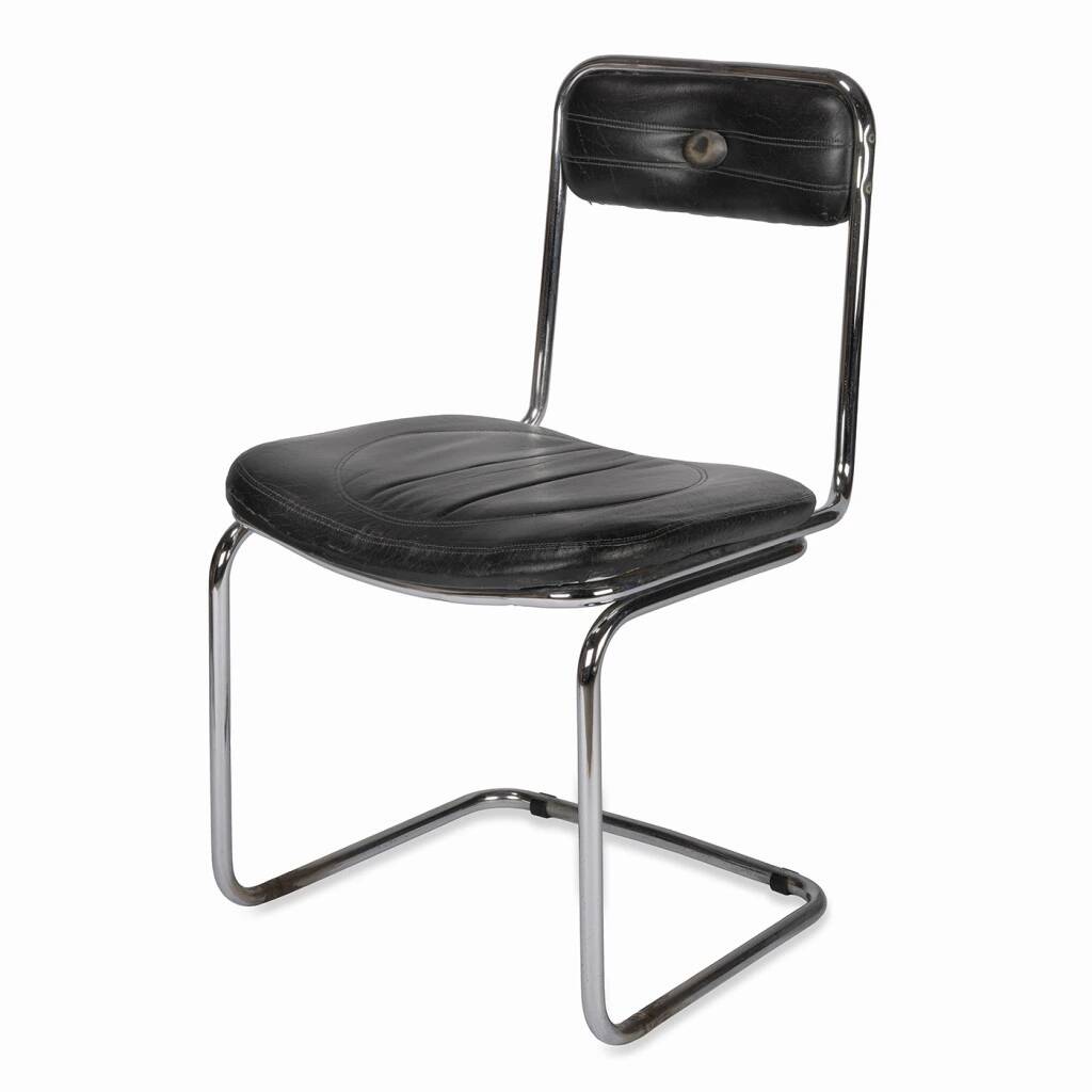 Tube chair with chrome steel base and seat and backrest made of soft black leatherette.