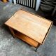 Coffee table, side table in light wood with saber legs.