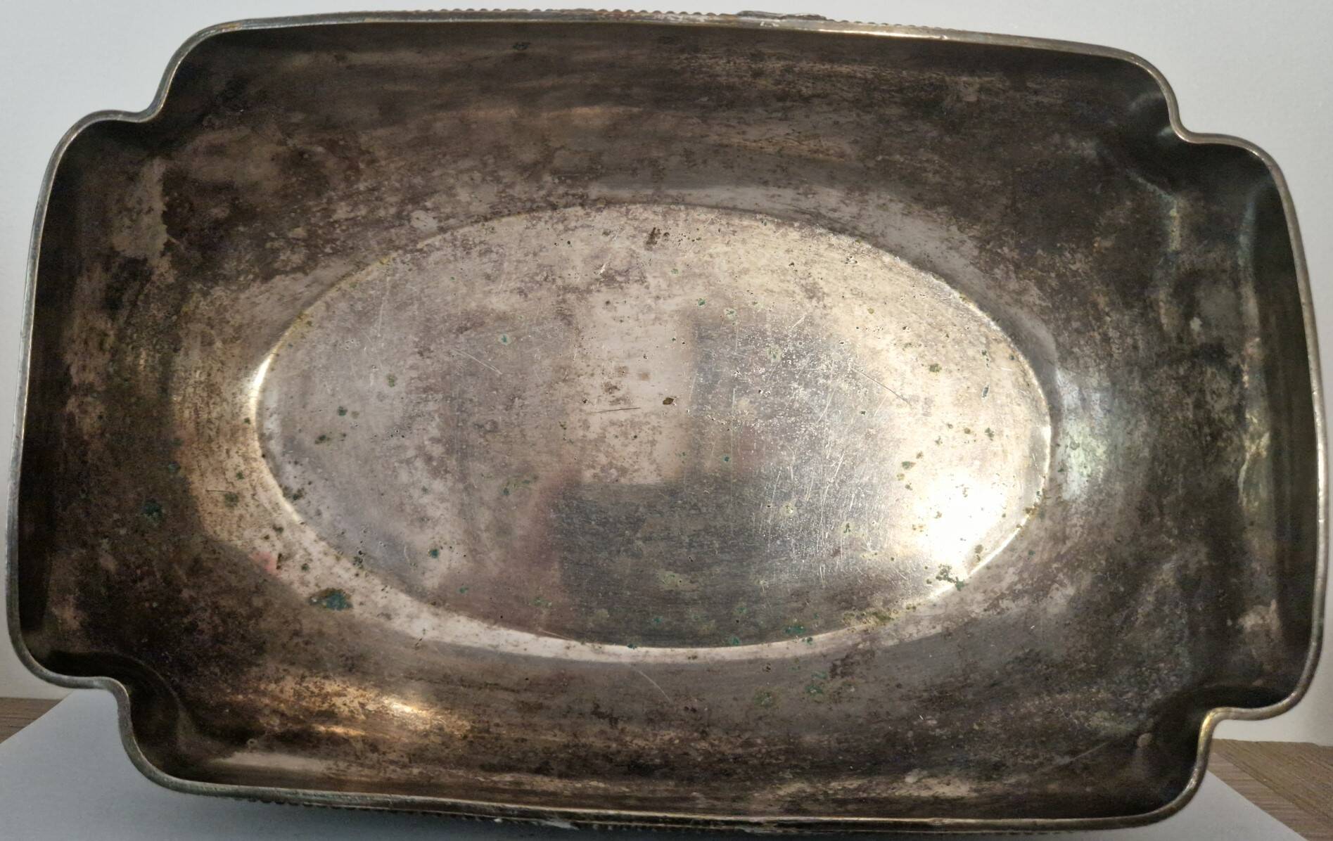 I037 Large shallow antique silver-plated dish in the Louis XVI style with bead decoration.