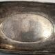 I037 Large shallow antique silver-plated dish in the Louis XVI style with bead decoration.