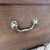 Teak chest from Burma with carved rosettes.