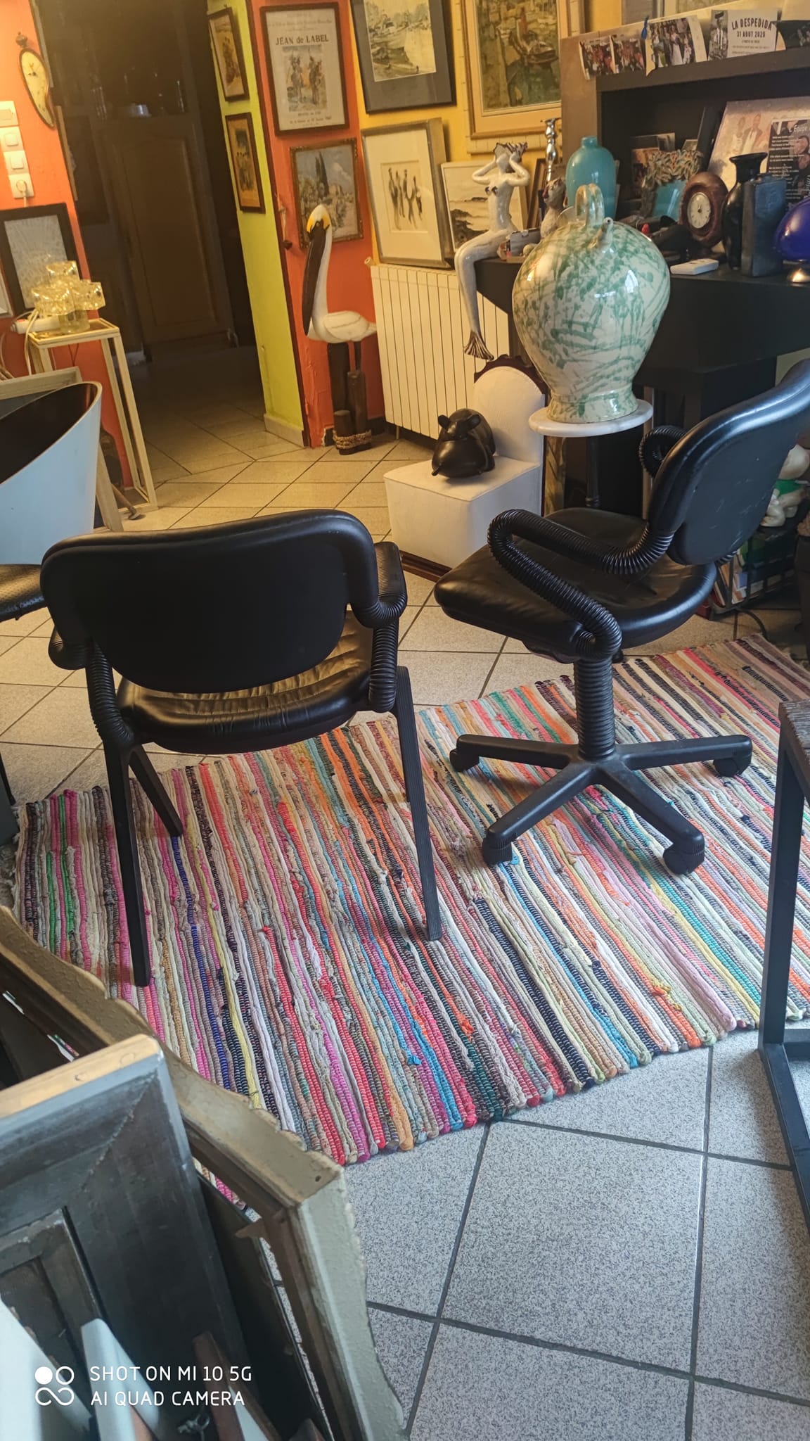 Two black leather armchairs