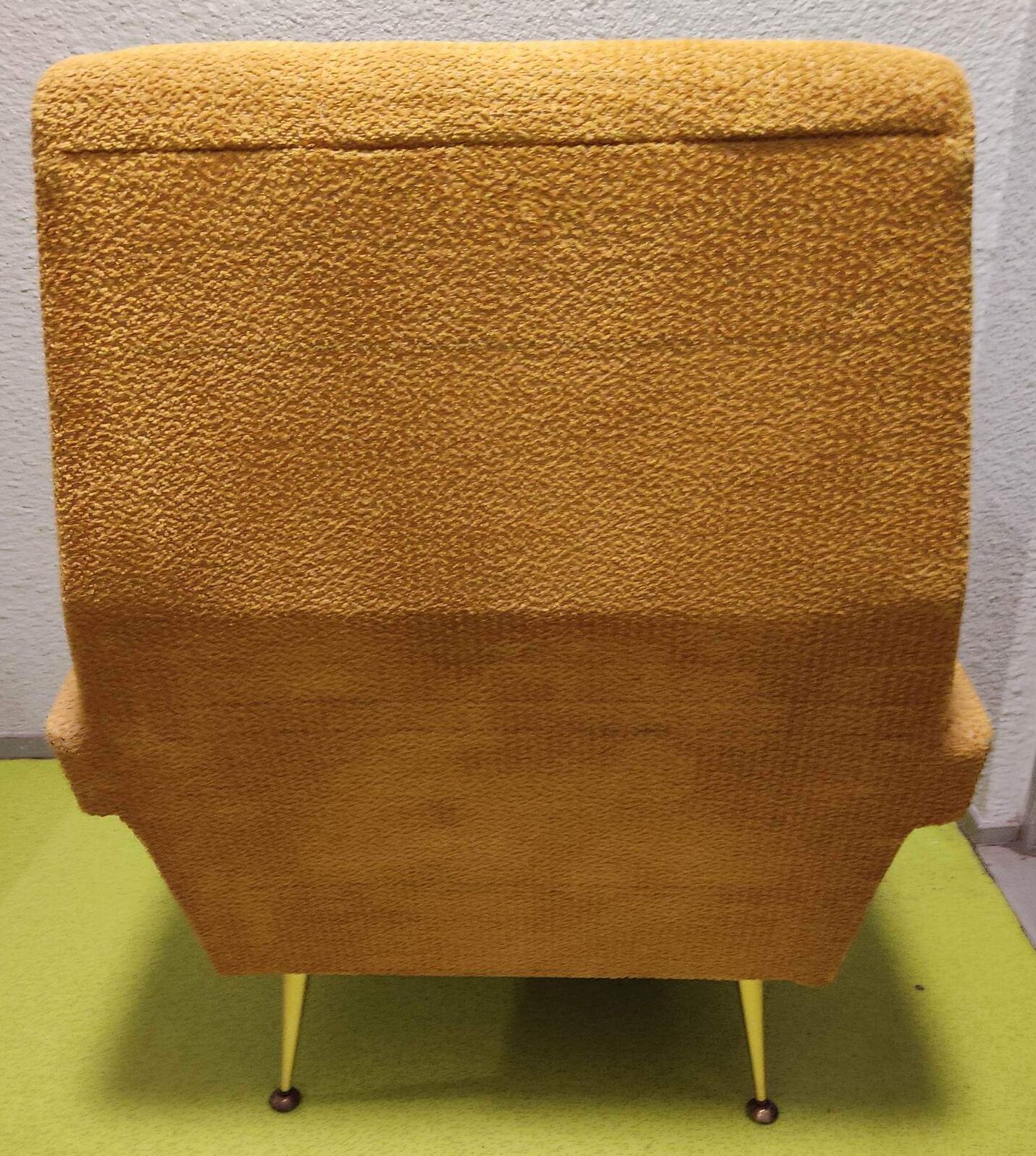 Old velvet heating chair on metal legs