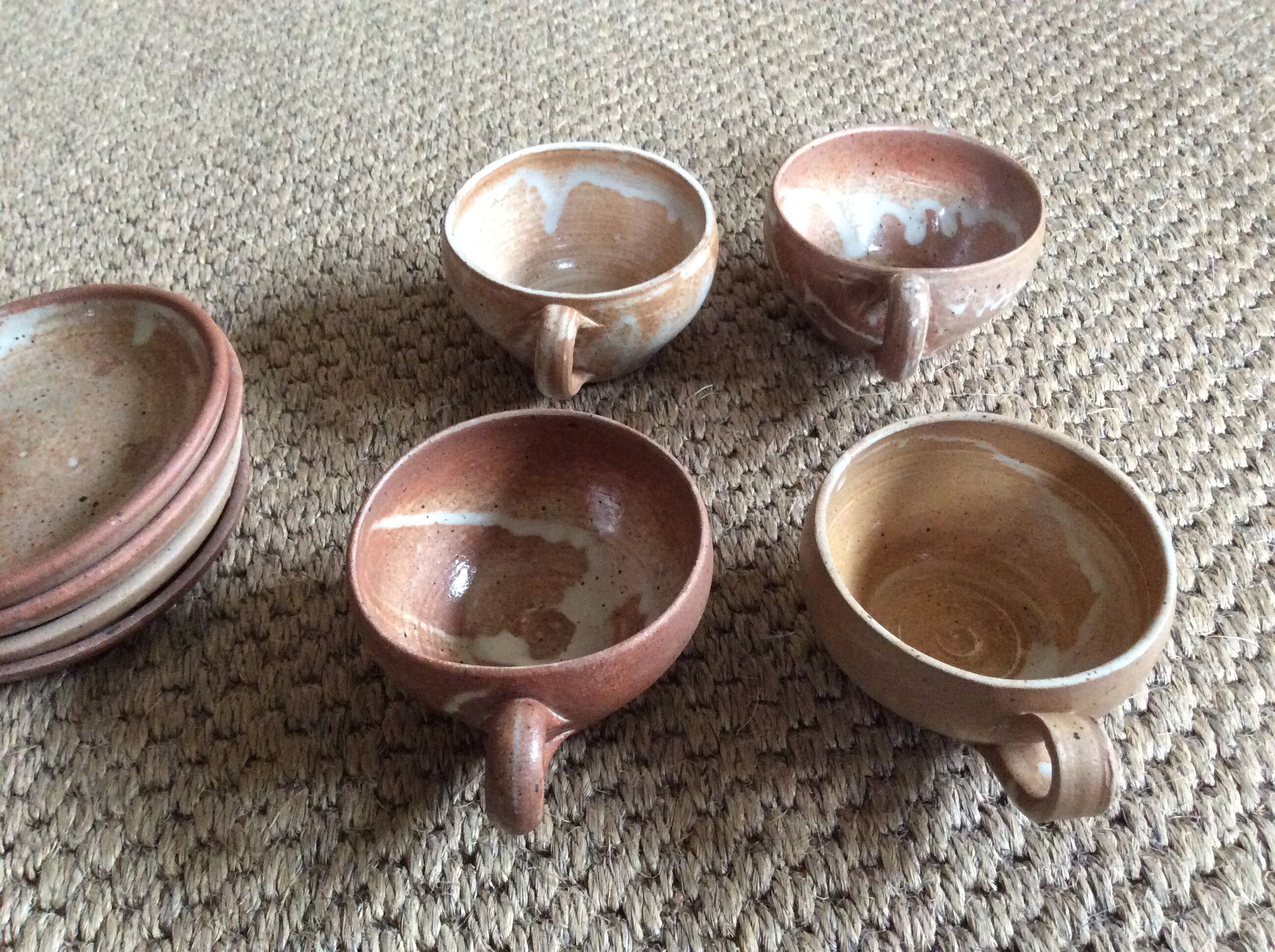 Series of 4 stoneware coffee cups