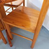 Suite of a round table with extension and 4 vintage pine chairs from the 60s and 70s