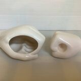 Duo of candle holder and empty pocket in the shape of a hand