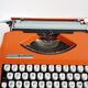 Hermes Baby orange typewriter