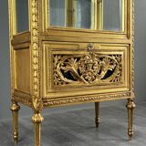 Carved and gilded wooden display cabinet, Louis XVI style, 20th century.