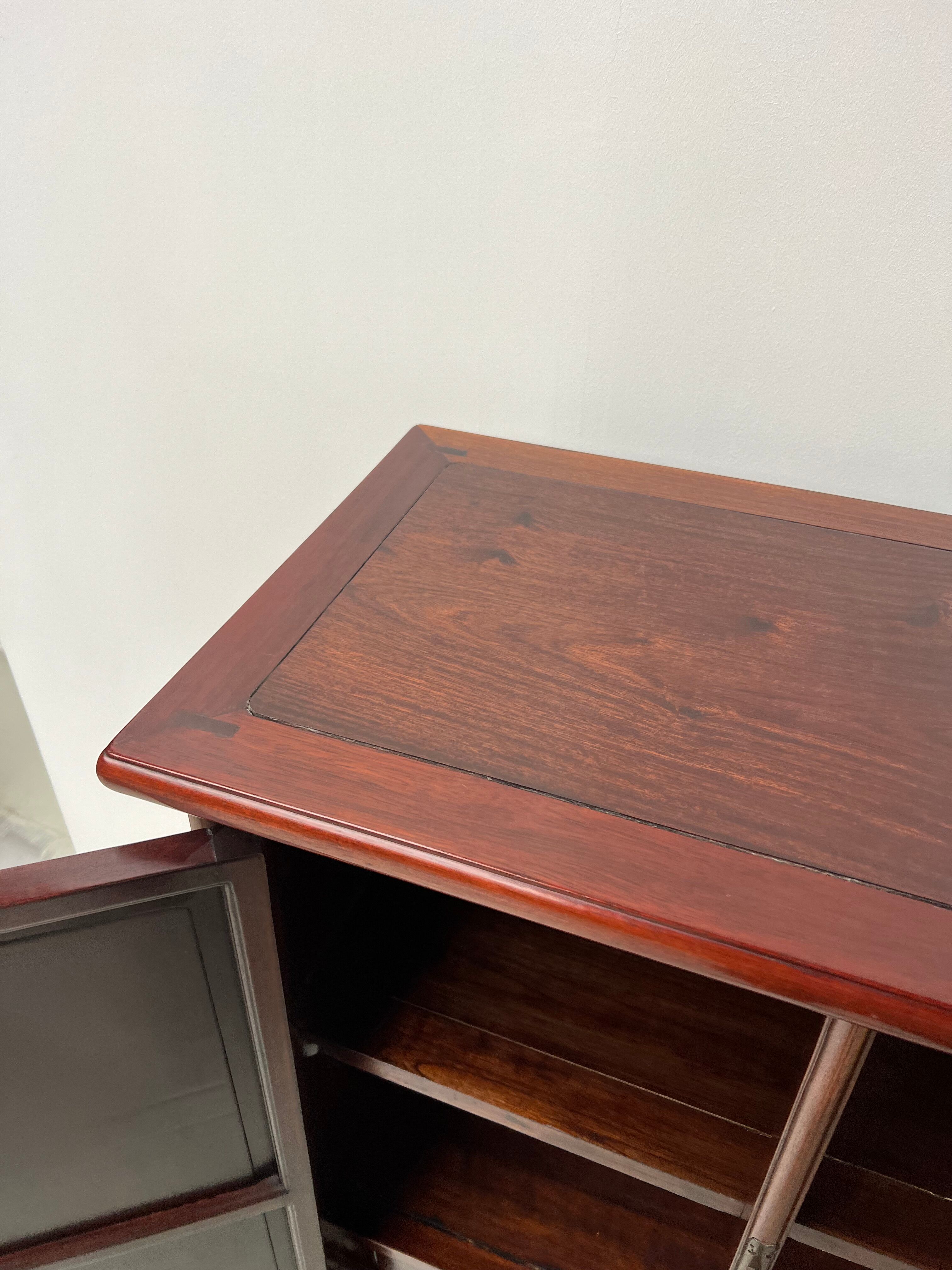 Chinese trapezoidal roller cabinet, made of rosewood.