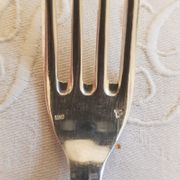 Silver cutlery set for 36 place settings and its ladle.