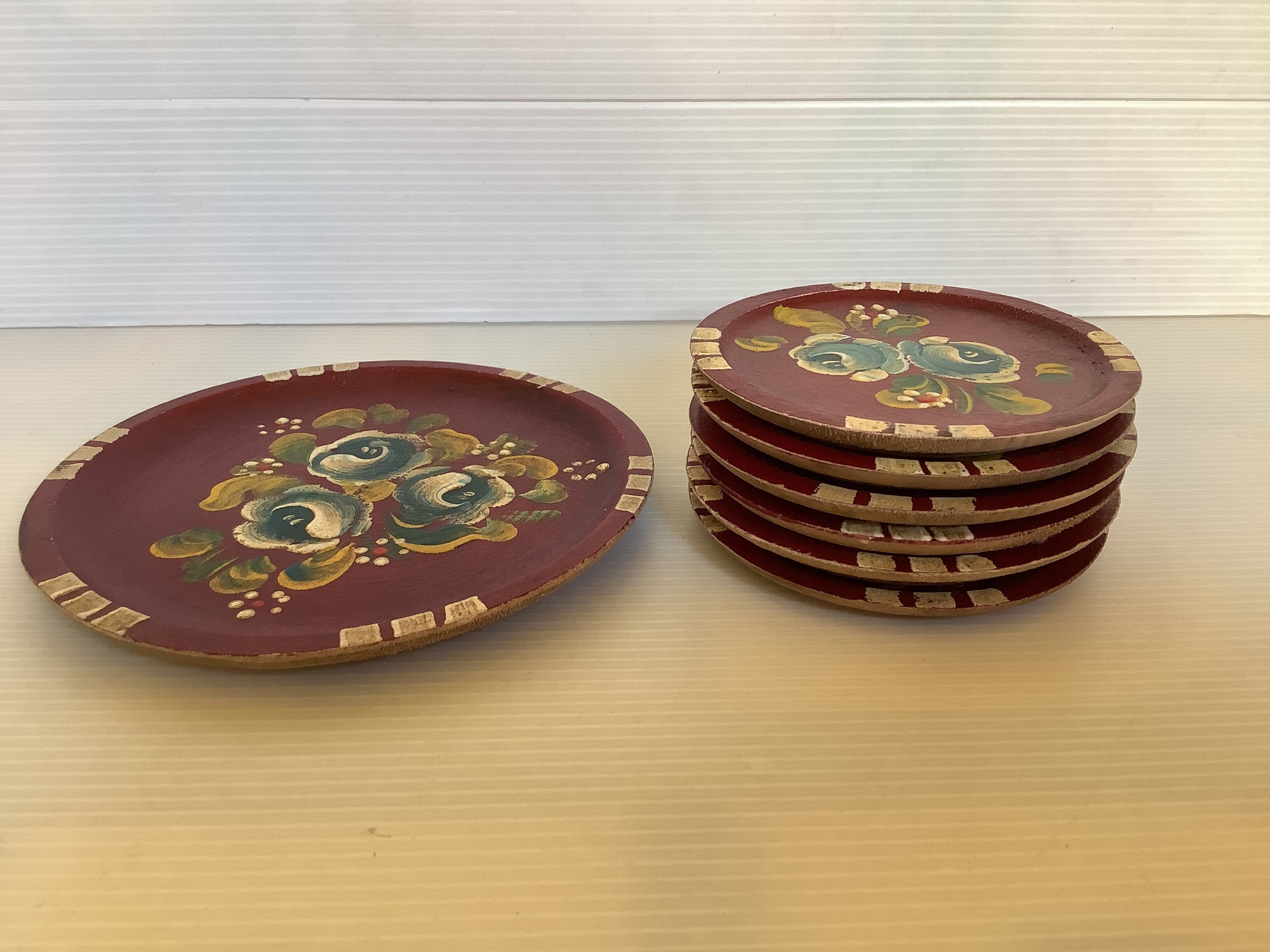 Six coasters of glass wood painted in relief under bottle