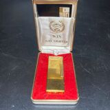 Lighter with its golden box
