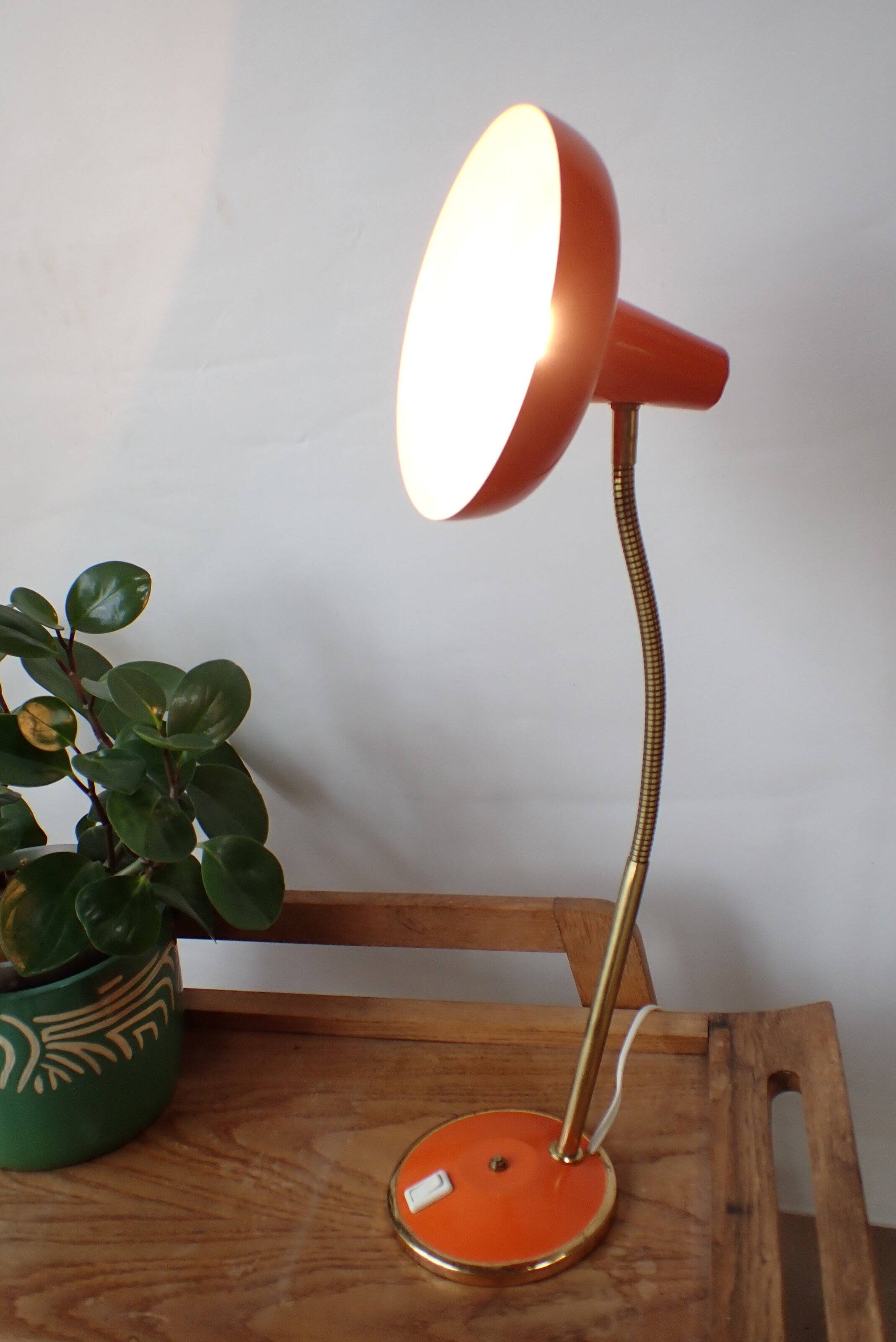 Vintage adjustable lamp, orange, made of metal.