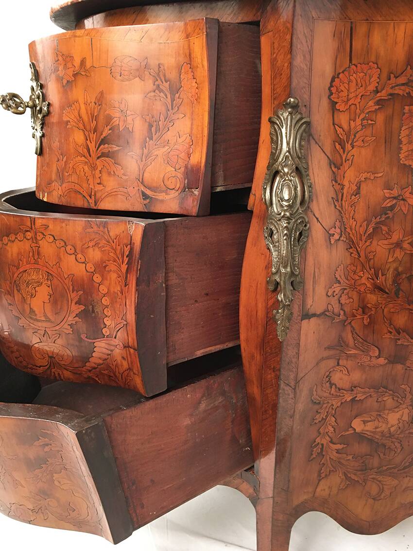 Louis XV style chest of drawers, richly inlaid, animated front and side. 19th century