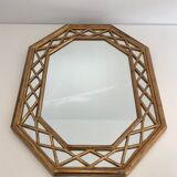 Octagonal mirror in gilded wood with closed guards
