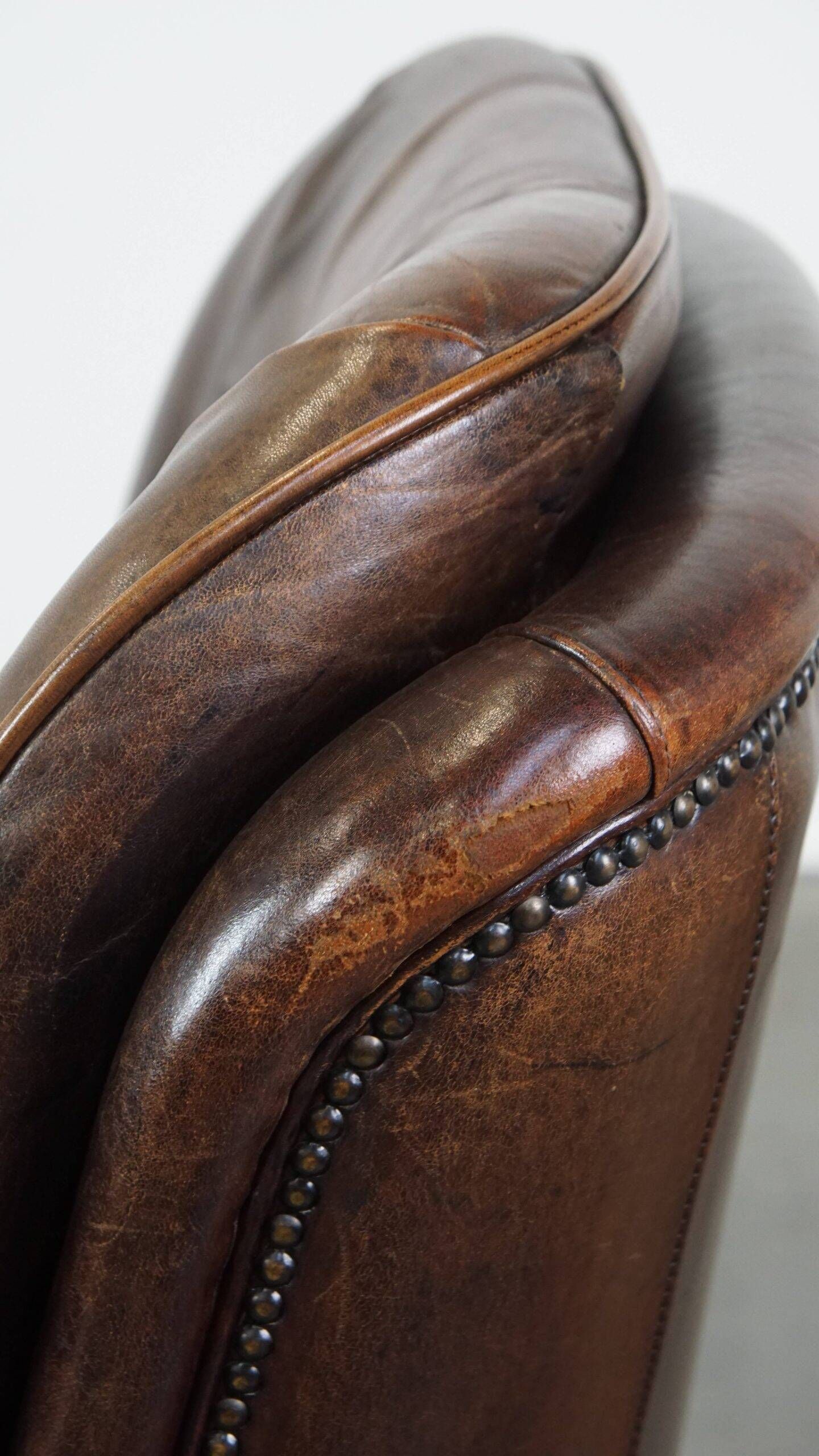 Vintage sheepskin armchair in a dark cognac colour with a comfortable seat