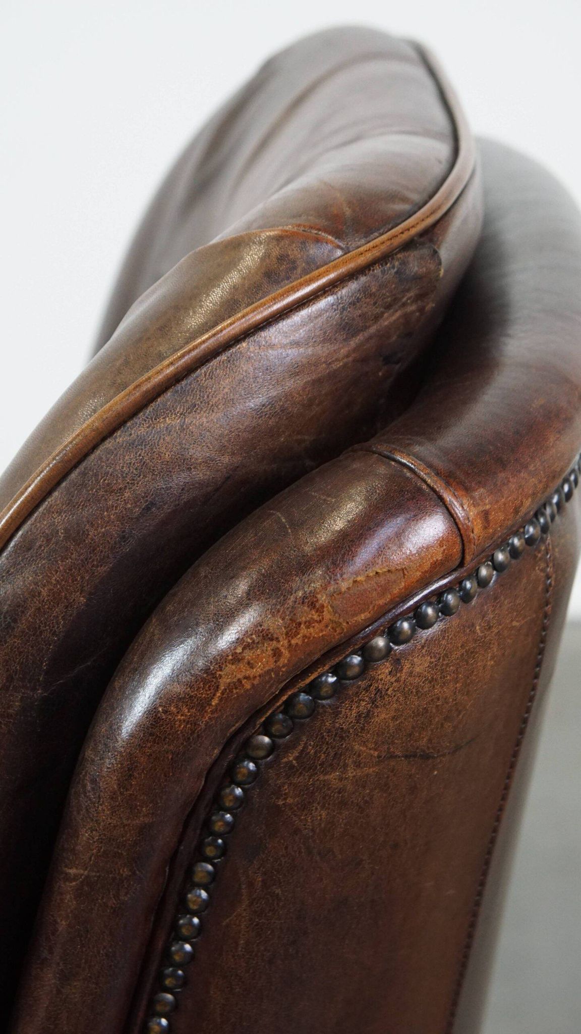 Vintage sheepskin armchair in a dark cognac colour with a comfortable seat