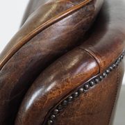 Vintage sheepskin armchair in a dark cognac colour with a comfortable seat
