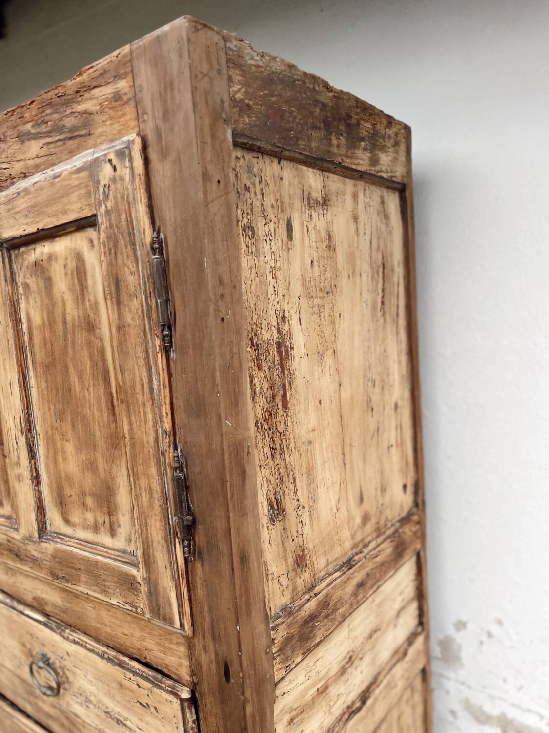 Rustic and vintage wardrobe in raw wood, wabi-sabi style.