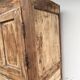 Rustic and vintage wardrobe in raw wood, wabi-sabi style.