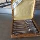 Box of 8 small art deco spoons in silver metal