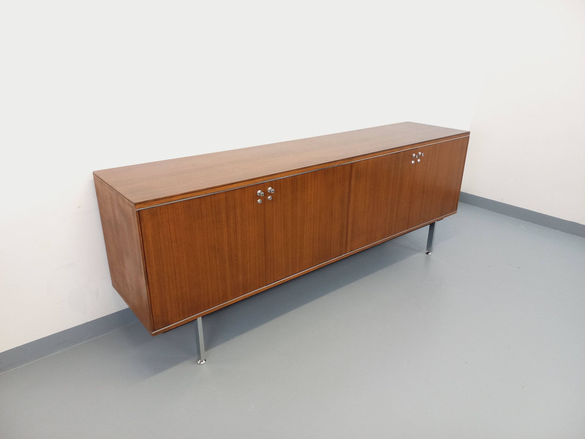 Vintage modernist enfilade in rosewood and chrome metal from the 60s and 70s.