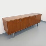 Vintage modernist enfilade in rosewood and chrome metal from the 60s and 70s.