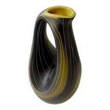 Earthenware vase decorated with yellow lines on a black and yellow background