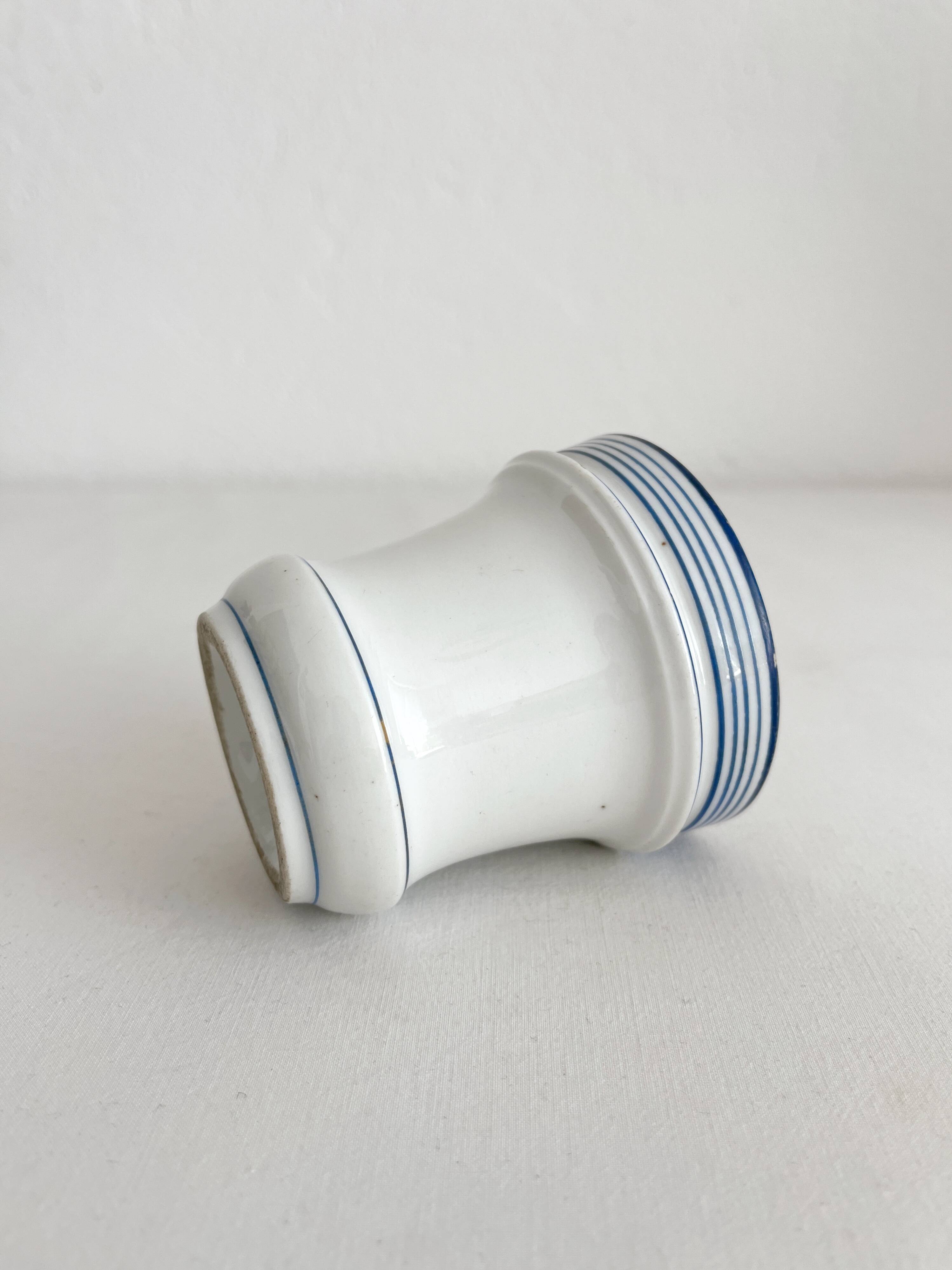 Antique porcelain teacup with blue rims, 19th century