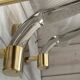 Set of 3 Murano glass wall lamps in white and brass, 1970s.