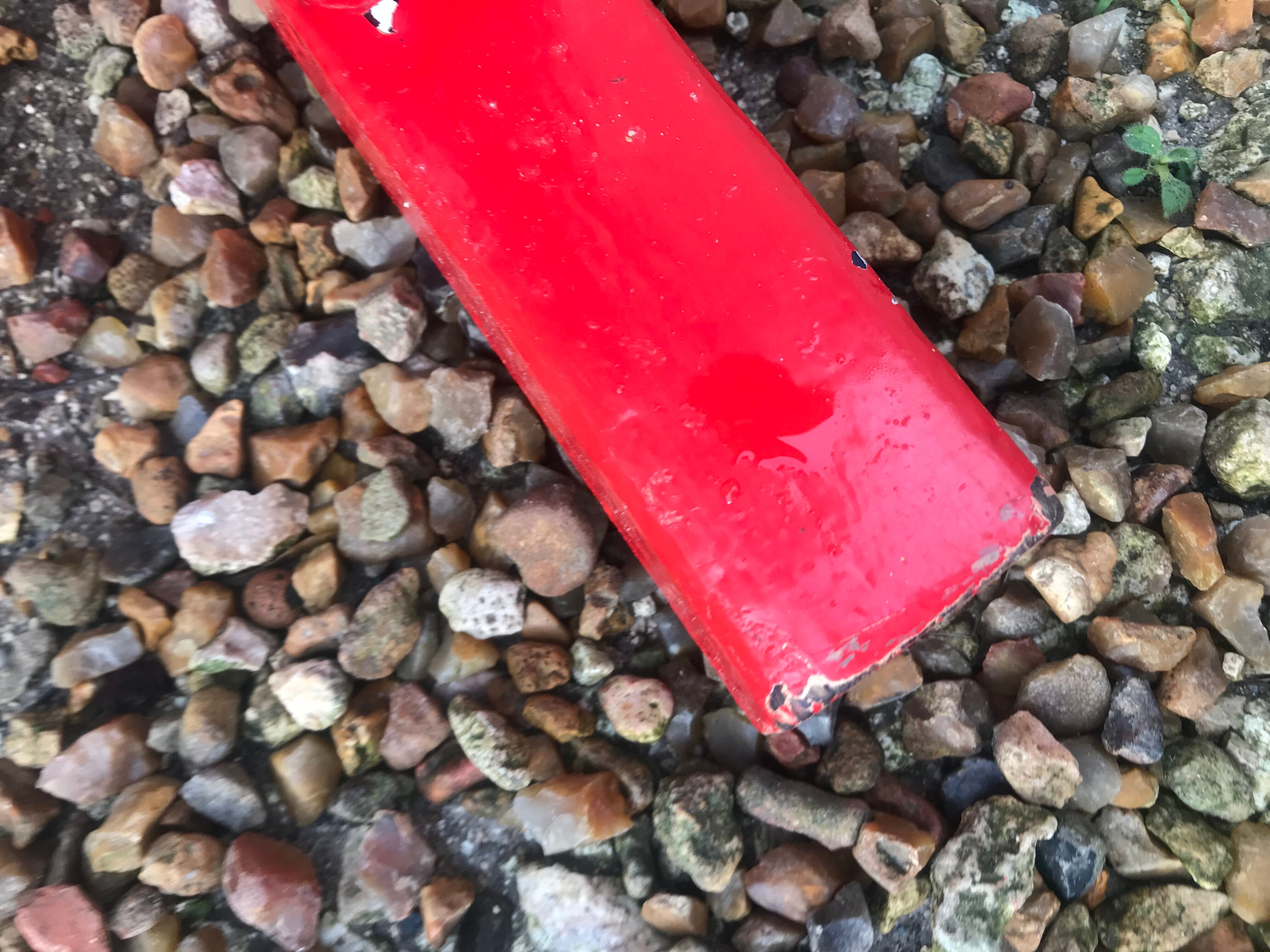 Red old schoolboy bench