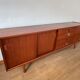 Scandinavian teak sideboard, 230 cm long, with 3 doors and 4 drawers.
