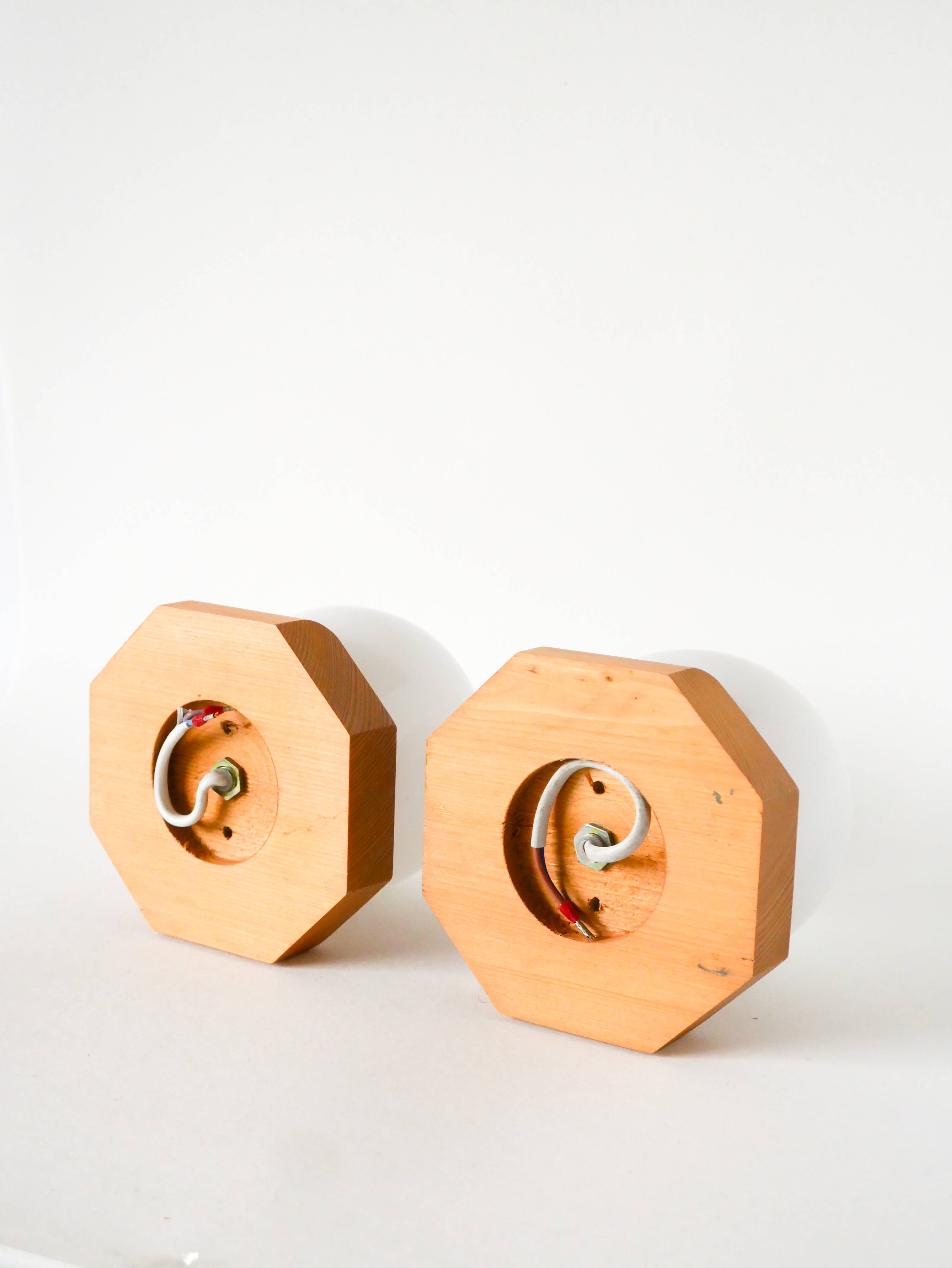 Pair of globe wall lights in opaline with a pine base, 1980.