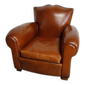 Club chair with a moustache backrest
