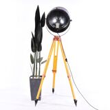 Old industrial spot on wooden tripod
