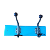 Wall coat holder with two metal pads