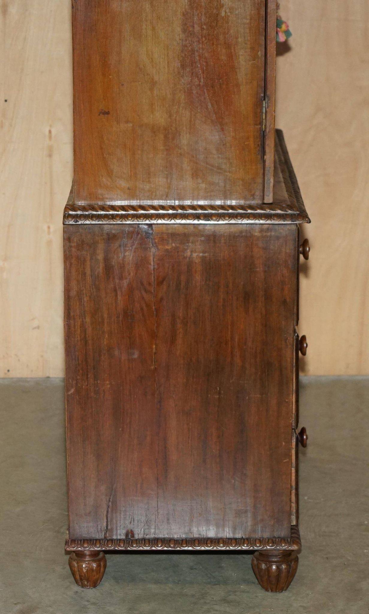 19th-century Anglo-Indian colonial hardwood library on a chest of drawers.