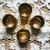 Four rounds of old brass towel around 1930