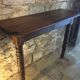 Oak console and walnut feet